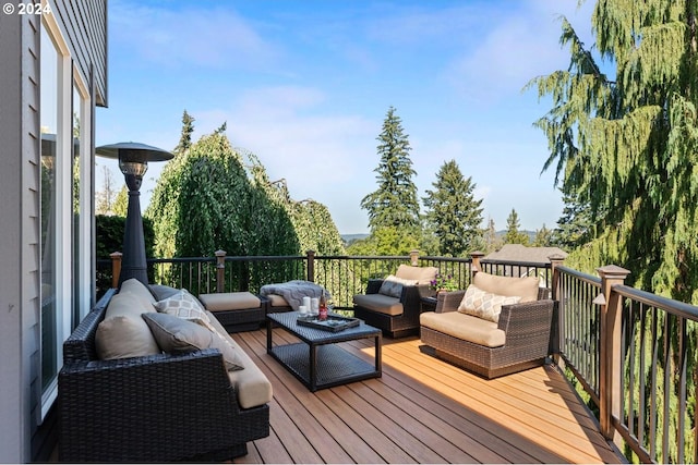 wooden deck with an outdoor living space