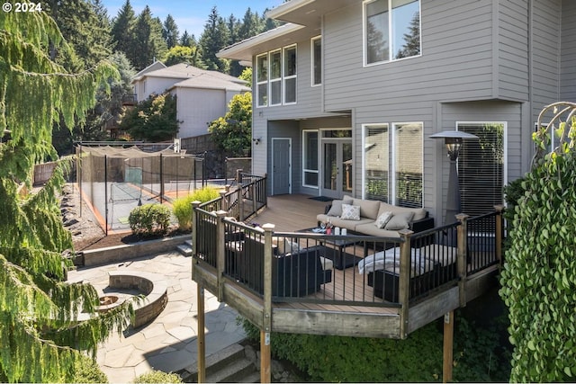 exterior space with an outdoor hangout area, a patio, french doors, and fence