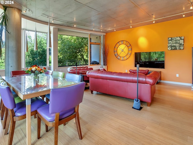 dining space featuring light wood-type flooring