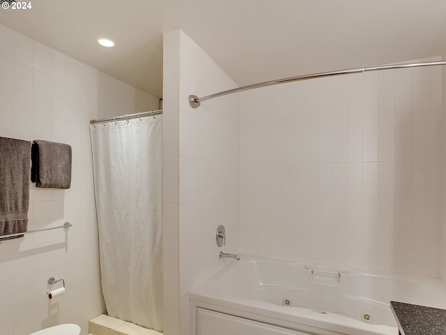 bathroom featuring toilet and tile walls