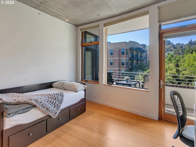 bedroom with light hardwood / wood-style flooring