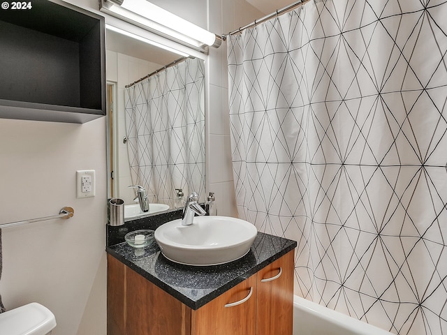 bathroom featuring shower / tub combo with curtain and vanity