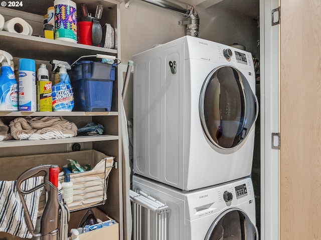 washroom with stacked washer and dryer