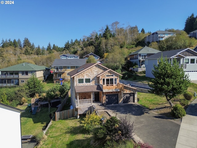 view of front of house with a front yard and a garage