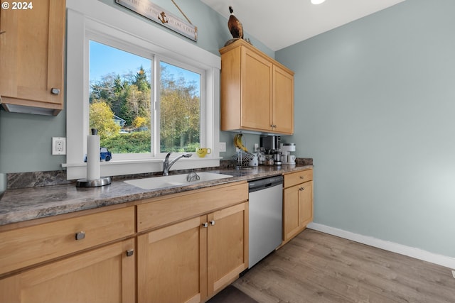 kitchen featuring sink, dishwasher, light hardwood / wood-style flooring, and light brown cabinets