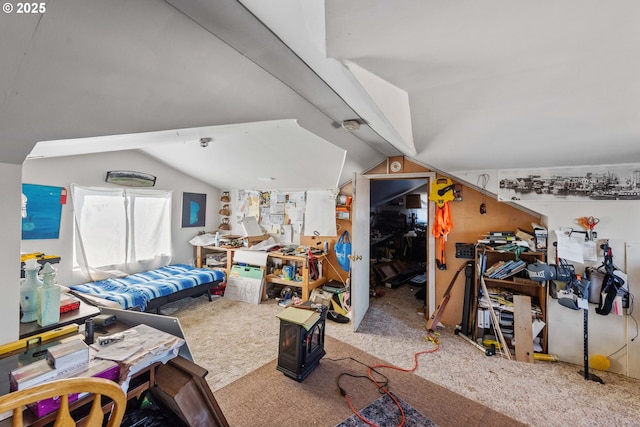 bedroom with carpet floors and lofted ceiling