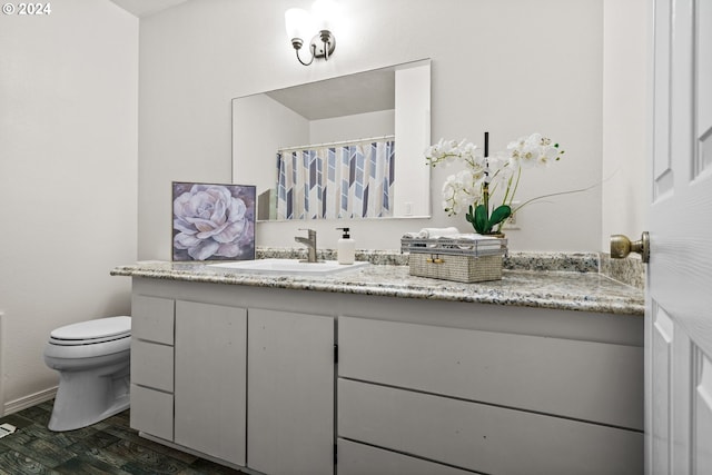 kitchen featuring sink, ceiling fan, appliances with stainless steel finishes, beamed ceiling, and a kitchen island