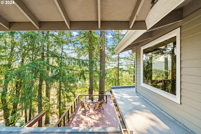 bedroom featuring hardwood / wood-style flooring, high vaulted ceiling, and a skylight