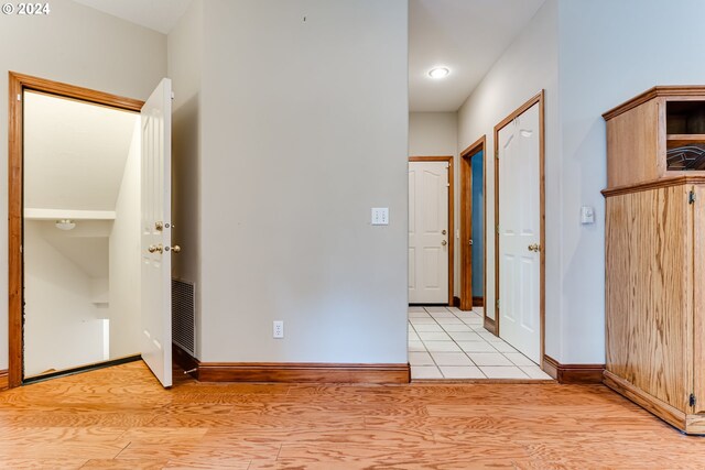 hallway with light wood-type flooring