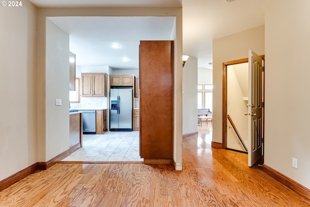 hall with light wood-type flooring