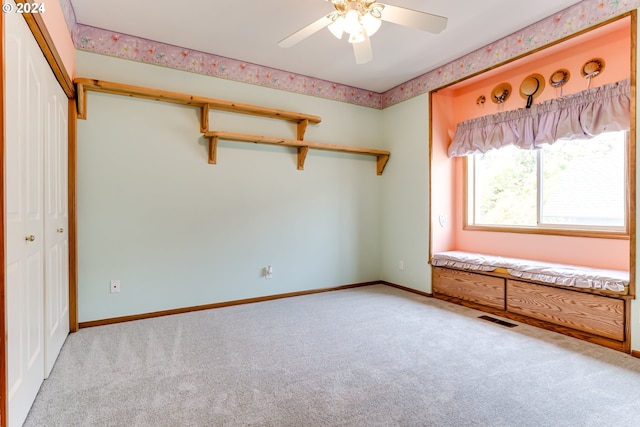 unfurnished bedroom featuring a closet, ceiling fan, and carpet flooring