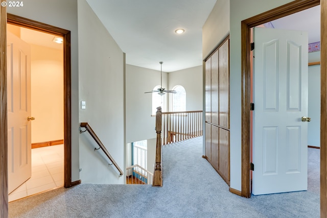 corridor with light colored carpet