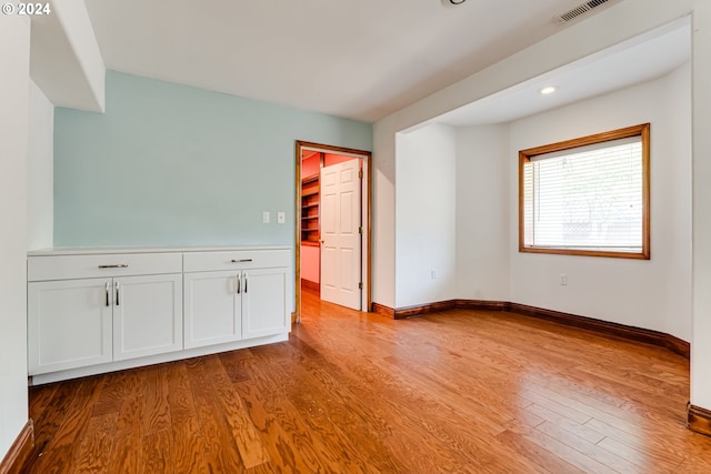 unfurnished room with light hardwood / wood-style floors