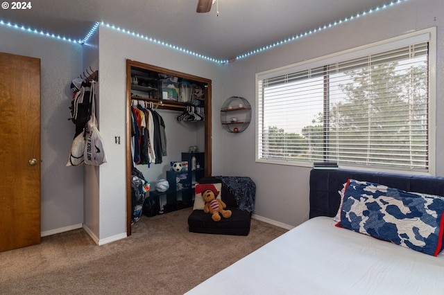 bedroom featuring carpet floors, a closet, and ceiling fan