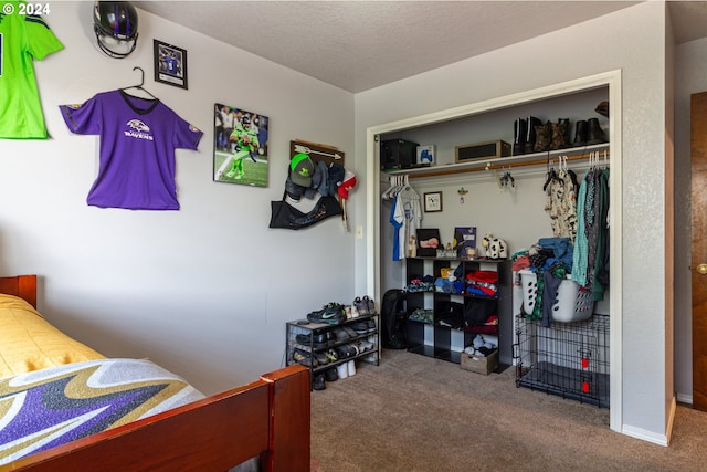 bedroom featuring a closet, a textured ceiling, and carpet floors