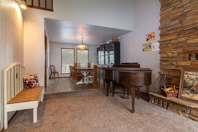 misc room with a textured ceiling and hardwood / wood-style floors