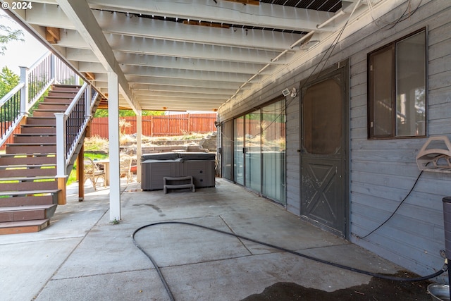 view of patio / terrace featuring a hot tub