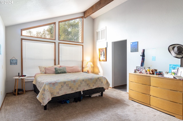 carpeted bedroom with lofted ceiling with beams