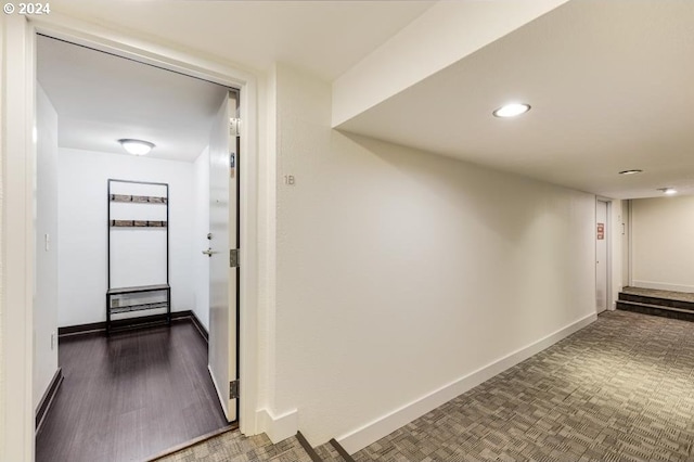 hall with dark hardwood / wood-style flooring