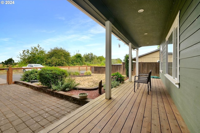 wooden terrace featuring a patio