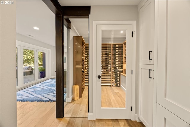 wine cellar featuring light wood-type flooring