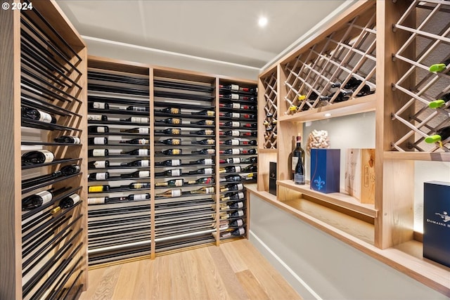 wine area with hardwood / wood-style flooring