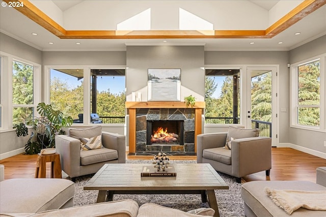 sunroom with a tray ceiling and vaulted ceiling