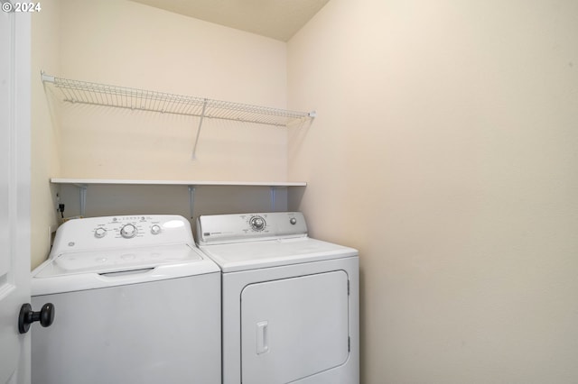 washroom featuring independent washer and dryer