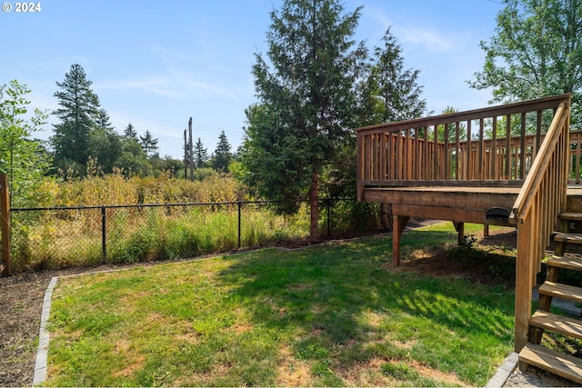 view of yard featuring a wooden deck