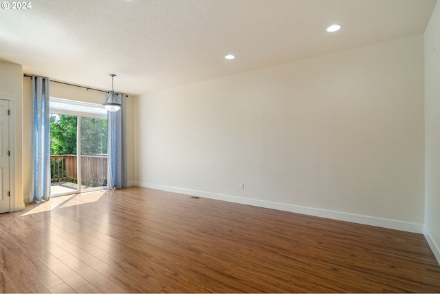 empty room featuring hardwood / wood-style floors