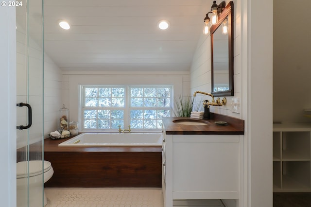 full bathroom featuring toilet, vaulted ceiling, vanity, independent shower and bath, and tile patterned flooring