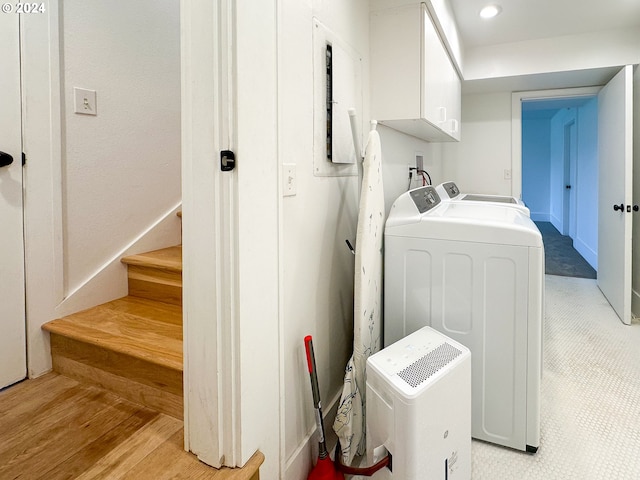 laundry room with cabinets and washing machine and dryer