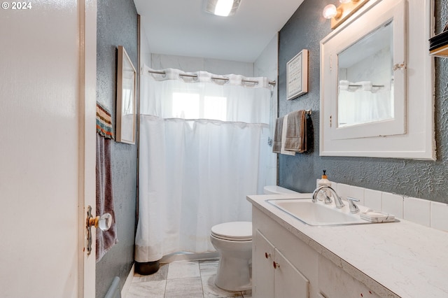 bathroom featuring vanity, a healthy amount of sunlight, toilet, and a shower with shower curtain