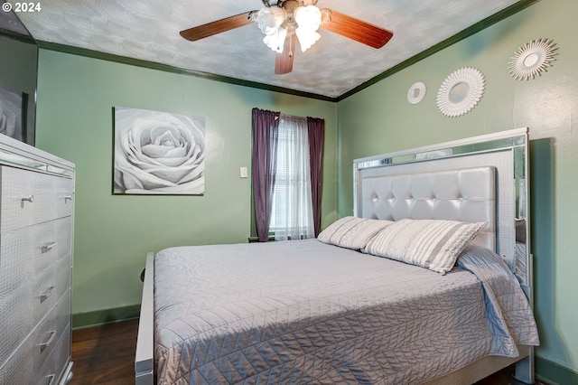 bedroom featuring ceiling fan, crown molding, a textured ceiling, and dark hardwood / wood-style flooring