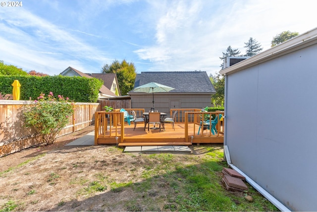 view of yard with a wooden deck