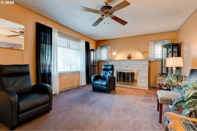 living room with a stone fireplace, a textured ceiling, and carpet