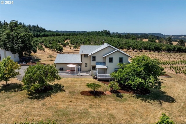 birds eye view of property with a rural view