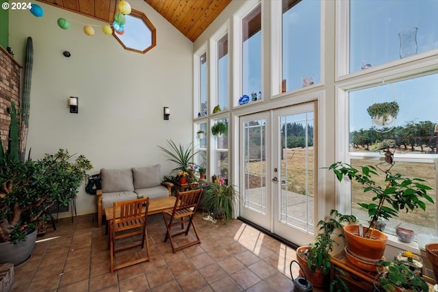 sunroom with vaulted ceiling, french doors, and wooden ceiling