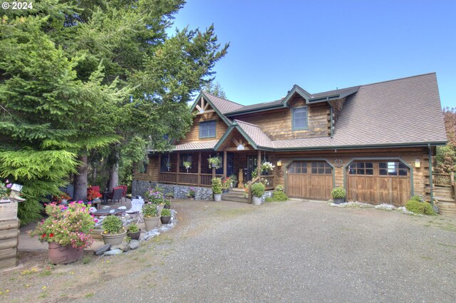 log cabin with covered porch