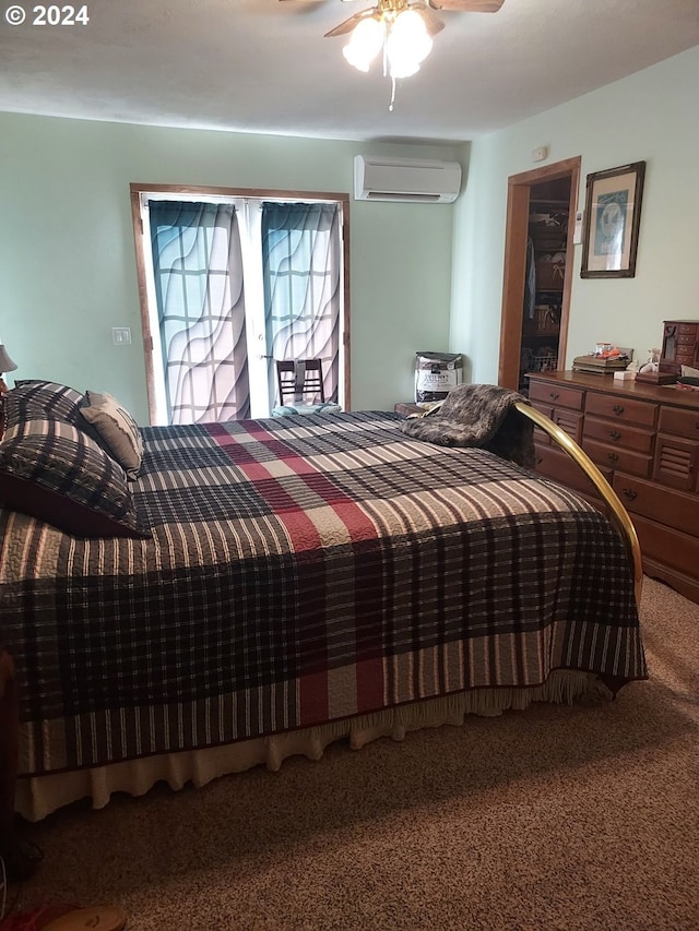 carpeted bedroom with a wall mounted air conditioner and ceiling fan