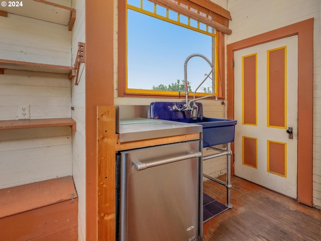 interior space with sink and hardwood / wood-style floors