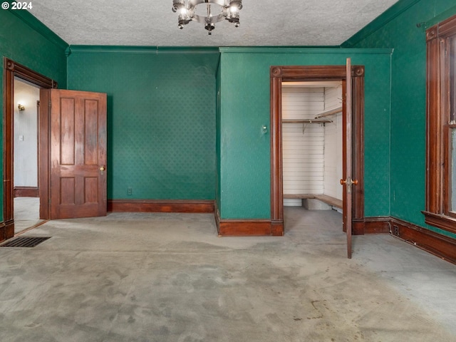 interior space with light carpet, a closet, and a textured ceiling