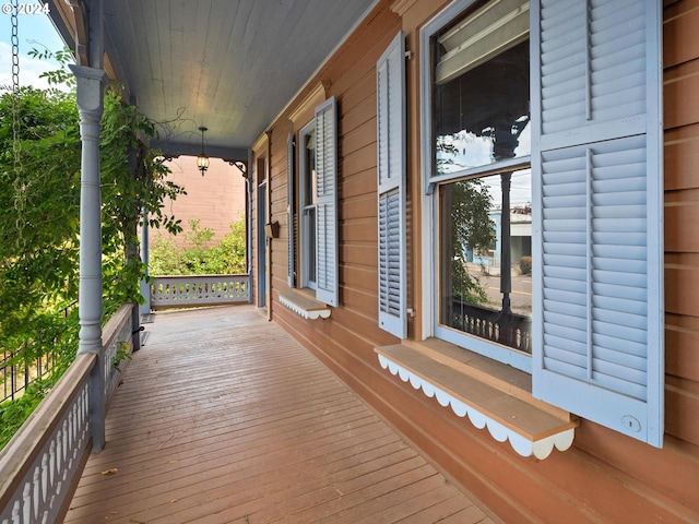 wooden terrace featuring a porch