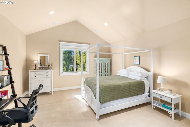 carpeted bedroom with lofted ceiling