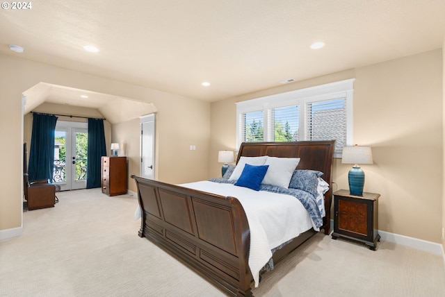 bedroom with access to outside, french doors, and light colored carpet