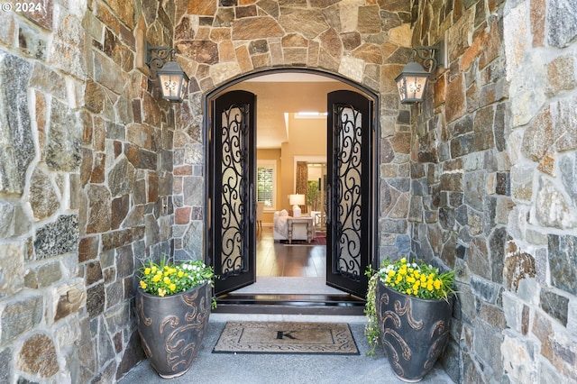 view of exterior entry featuring stone siding