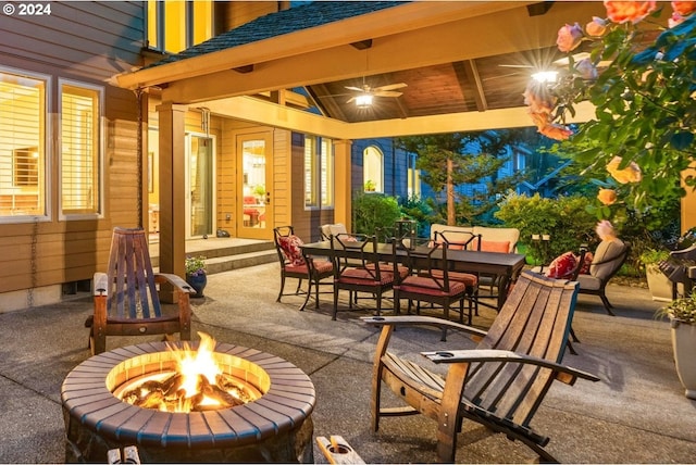 view of patio / terrace with a fire pit and ceiling fan