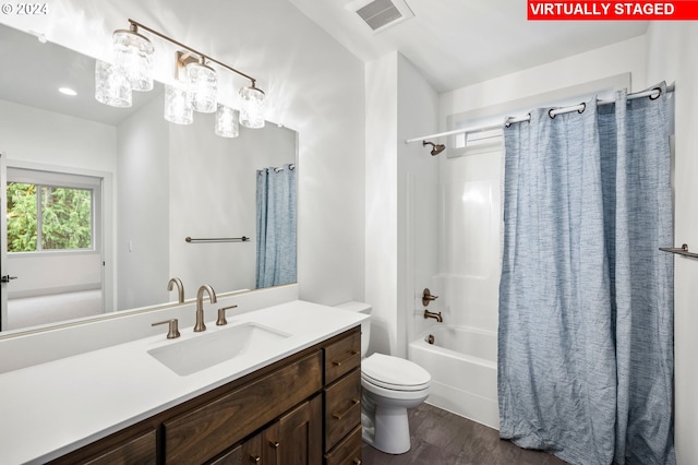 full bathroom with vanity, toilet, shower / tub combo, and hardwood / wood-style floors