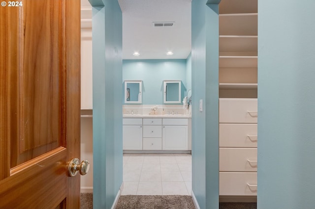 bathroom featuring vanity and tile patterned flooring