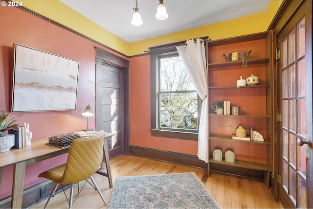 office with light hardwood / wood-style flooring